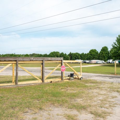 sliding wood gates on small road