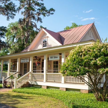 Home style building with grass and trees all around