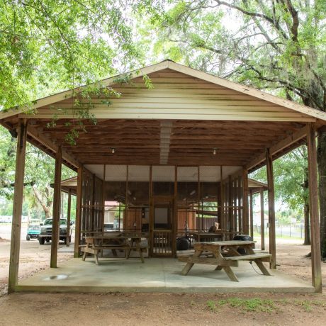 Outdoor recreational area with tables and benches