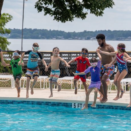 Group jumping into pool
